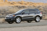 Picture of a driving 2015 Acura RDX in Graphite Luster Metallic from a side perspective