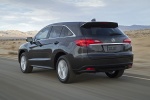 Picture of a driving 2015 Acura RDX in Graphite Luster Metallic from a rear left perspective