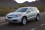 Picture of a driving 2015 Acura RDX in Silver Moon from a front three-quarter perspective