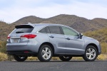 Picture of a 2015 Acura RDX in Forged Silver Metallic from a rear three-quarter perspective