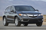 Picture of a driving 2015 Acura RDX in Graphite Luster Metallic from a front three-quarter perspective