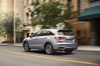 Picture of a driving 2018 Acura RDX AWD in Lunar Silver Metallic from a rear left perspective