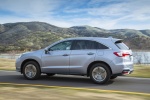 Picture of a driving 2018 Acura RDX AWD in Lunar Silver Metallic from a rear left three-quarter perspective