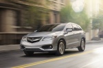 Picture of a driving 2018 Acura RDX AWD in Lunar Silver Metallic from a front left perspective