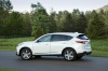Picture of a 2019 Acura RDX SH-AWD in White Diamond Pearl from a rear left three-quarter perspective