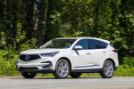 Picture of a driving 2019 Acura RDX SH-AWD in White Diamond Pearl from a front left three-quarter perspective