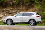 Picture of a driving 2019 Acura RDX SH-AWD in White Diamond Pearl from a left side perspective