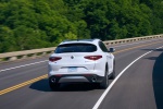 Picture of a driving 2020 Alfa Romeo Stelvio Ti Lusso AWD in Alfa White from a rear right perspective