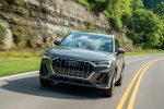 Picture of a driving 2019 Audi Q3 45 quattro in Nano Gray Metallic from a front left perspective