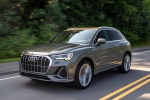 Picture of a driving 2019 Audi Q3 45 quattro in Nano Gray Metallic from a front left three-quarter perspective