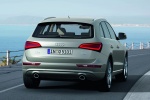 Picture of a driving 2015 Audi Q5 2.0 TFSI Quattro in Cuvee Silver Metallic from a rear right perspective
