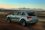 Picture of a driving 2015 Audi Q5 2.0 TFSI Quattro in Cuvee Silver Metallic from a rear left three-quarter perspective