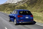 Picture of a driving 2015 Audi SQ5 Quattro in Scuba Blue Metallic from a rear left perspective