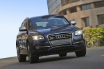 Picture of a driving 2015 Audi SQ5 Quattro in Scuba Blue Metallic from a front right perspective