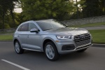 Picture of a driving 2018 Audi Q5 quattro in Florett Silver Metallic from a front right three-quarter perspective