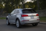 Picture of a driving 2018 Audi Q5 quattro in Florett Silver Metallic from a rear left perspective
