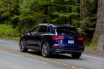 Picture of a driving 2018 Audi SQ5 quattro in Navarra Blue Metallic from a rear left three-quarter perspective