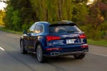 Picture of a driving 2018 Audi SQ5 quattro in Navarra Blue Metallic from a rear left perspective