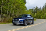 Picture of a driving 2019 Audi SQ5 quattro in Navarra Blue Metallic from a front left three-quarter perspective