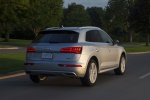 Picture of a driving 2020 Audi Q5 45 TFSI quattro in Florett Silver Metallic from a rear right perspective
