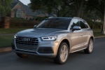 Picture of a driving 2020 Audi Q5 45 TFSI quattro in Florett Silver Metallic from a front left perspective