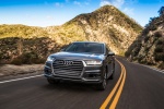 Picture of a driving 2017 Audi Q7 3.0T quattro in Graphite Gray Metallic from a front left perspective