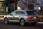 Picture of a driving 2017 Audi Q7 3.0T quattro in Graphite Gray Metallic from a rear left three-quarter perspective