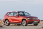 Picture of a 2014 BMW X1 in Valencia Orange Metallic from a front right three-quarter perspective
