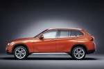 Picture of a 2015 BMW X1 in Valencia Orange Metallic from a left side perspective