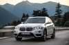 Picture of a driving 2016 BMW X1 xDrive28i in Alpine White from a front left perspective