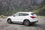 Picture of a 2018 BMW X1 xDrive28i in Alpine White from a rear left three-quarter perspective