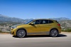 Picture of a driving 2018 BMW X2 in Galvanic Gold Metallic from a left side perspective