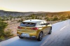 Picture of a driving 2018 BMW X2 in Galvanic Gold Metallic from a rear right perspective