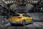 Picture of a 2018 BMW X2 in Galvanic Gold Metallic from a rear right three-quarter perspective