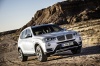 Picture of a driving 2015 BMW X3 in Mineral White Metallic from a front right three-quarter perspective
