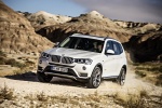 Picture of a driving 2015 BMW X3 in Mineral White Metallic from a front left three-quarter perspective