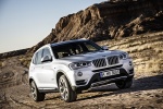 Picture of a driving 2017 BMW X3 in Mineral White Metallic from a front right three-quarter perspective