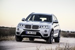 Picture of a driving 2017 BMW X3 in Mineral White Metallic from a front left perspective