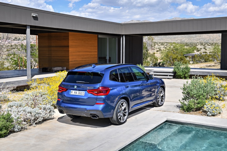 Picture of a 2018 BMW X3 M40i in Phytonic Blue Metallic from a rear right perspective