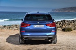 Picture of a 2018 BMW X3 M40i in Phytonic Blue Metallic from a rear perspective