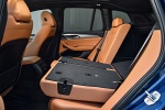 Picture of a 2018 BMW X3 M40i's Rear Seats Folded in Cognac