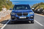Picture of a driving 2020 BMW X3 M40i in Phytonic Blue Metallic from a frontal perspective