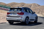 Picture of a driving 2020 BMW X3 M Competition in Donington Gray Metallic from a rear right perspective