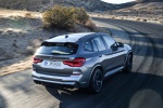 Picture of a driving 2020 BMW X3 M Competition in Donington Gray Metallic from a rear right three-quarter perspective