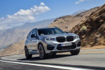Picture of a driving 2020 BMW X3 M Competition in Donington Gray Metallic from a front right perspective