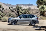 Picture of a driving 2020 BMW X3 M Competition in Donington Gray Metallic from a left side perspective