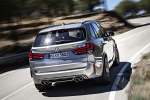 Picture of a driving 2017 BMW X5 M in Donington Gray Metallic from a rear right perspective