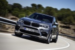 Picture of a driving 2017 BMW X5 M in Donington Gray Metallic from a front left perspective