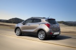 Picture of a driving 2016 Buick Encore from a rear left three-quarter perspective