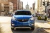 Picture of a driving 2017 Buick Encore in Coastal Blue Metallic from a frontal perspective